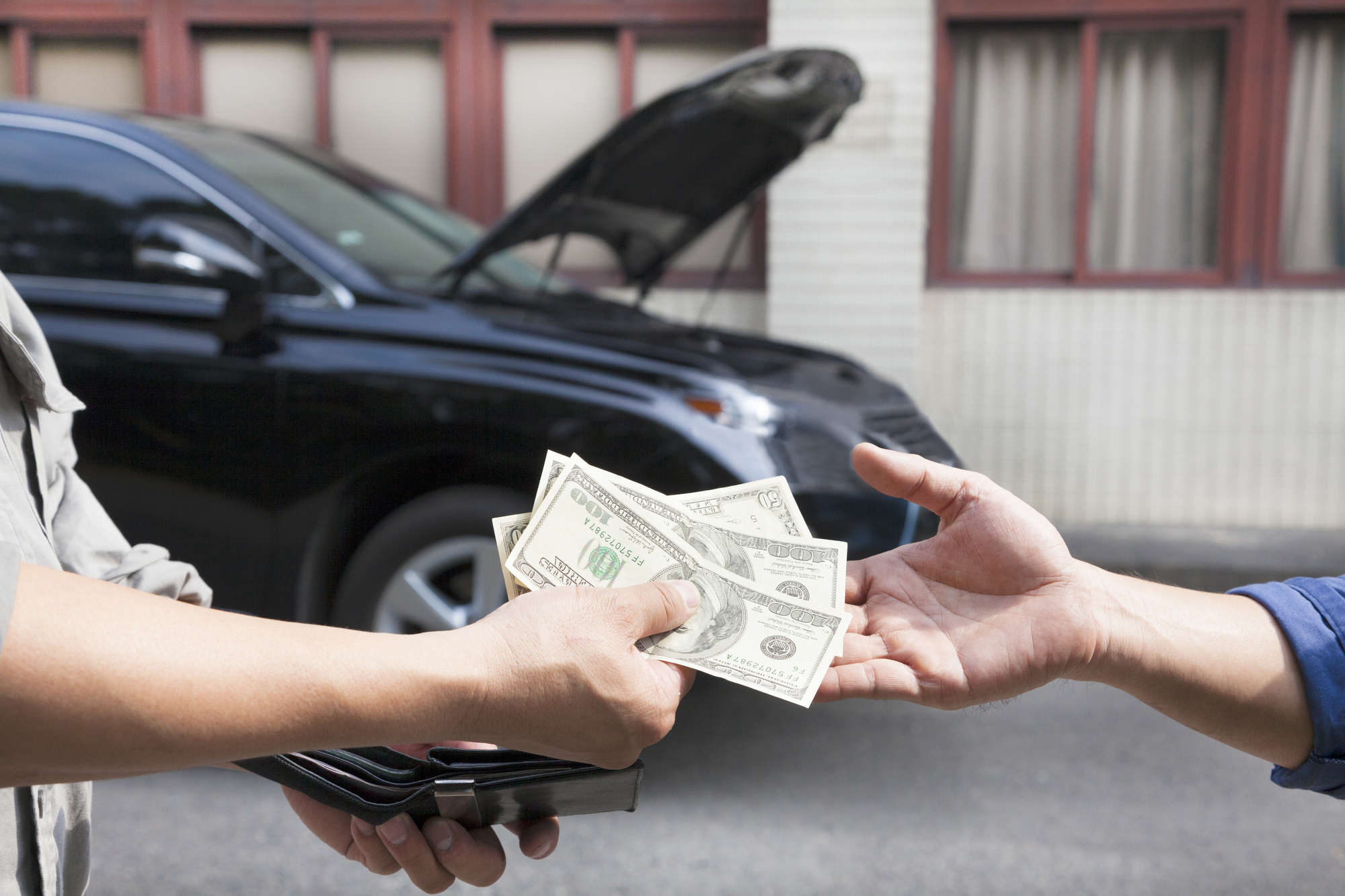 person paying for car repairs