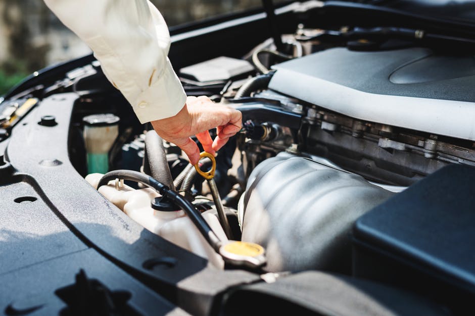 person working on car