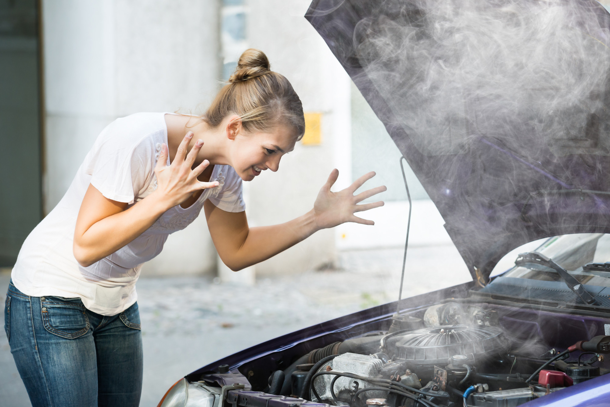 woman with car engine problems
