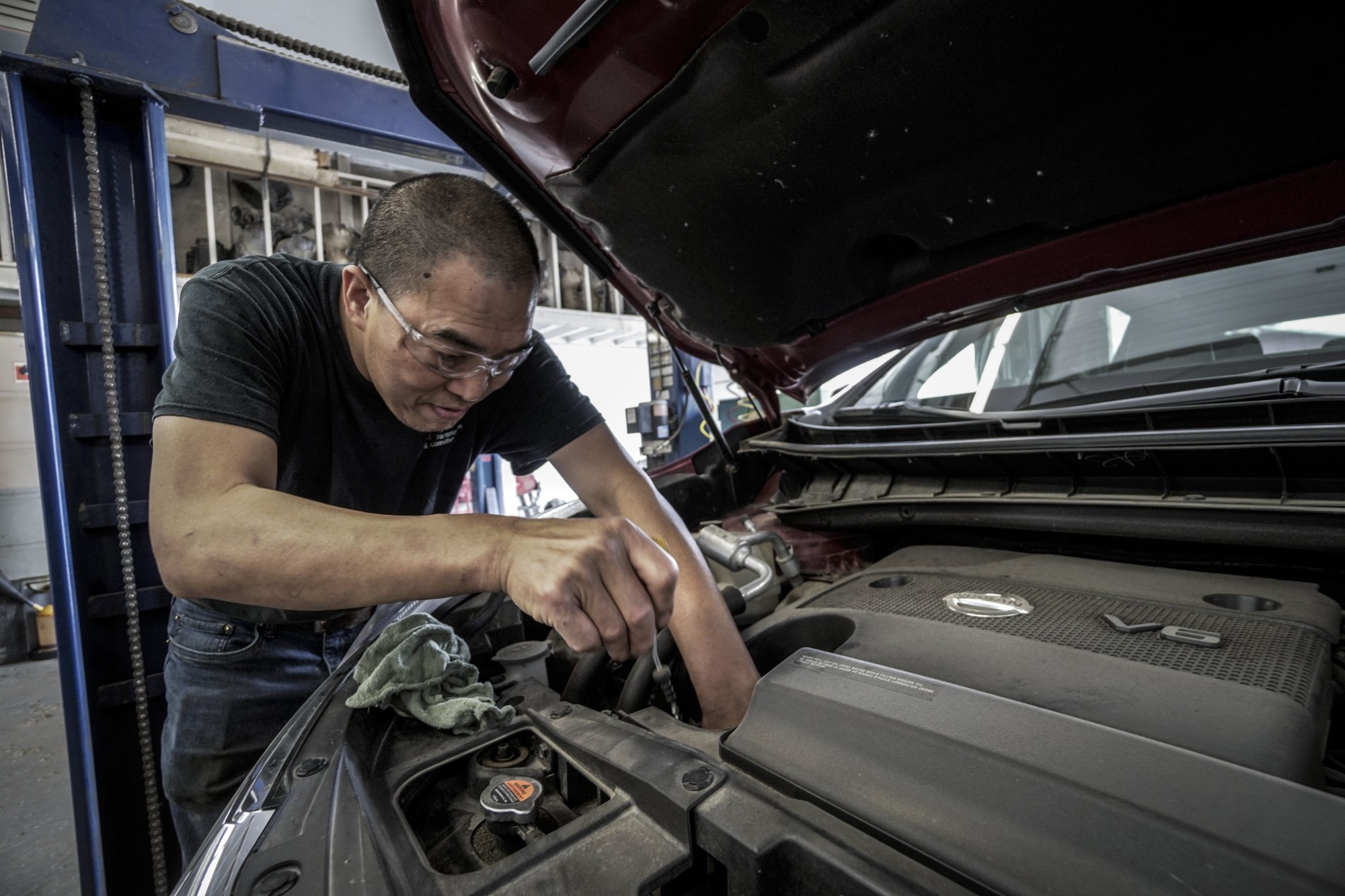 person fixing a car