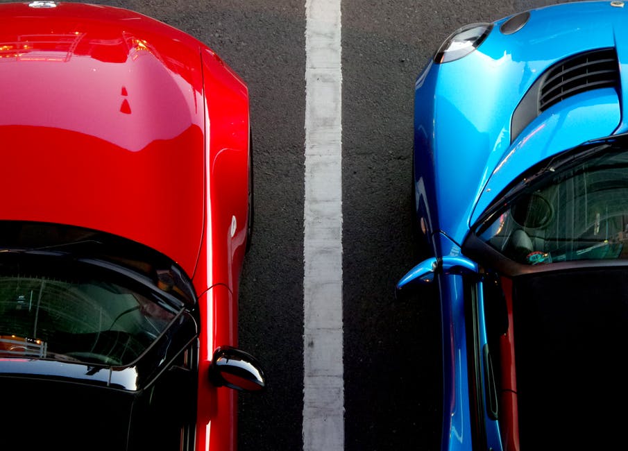 red and blue painted autos