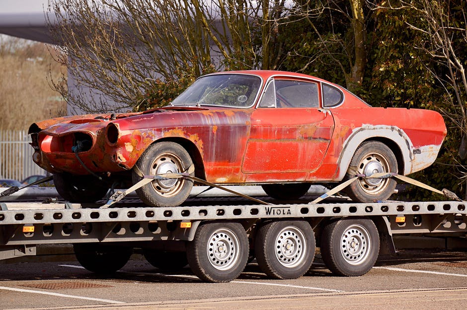 junk car on flatbed