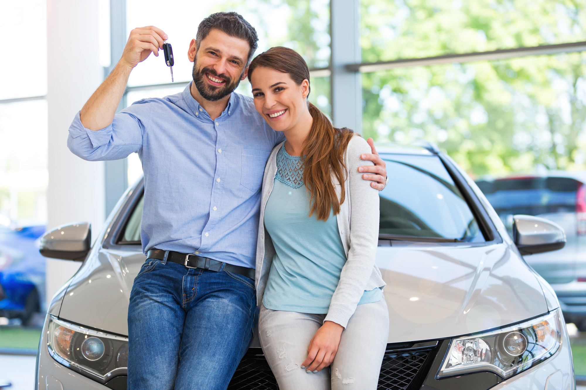 couple buying a new car