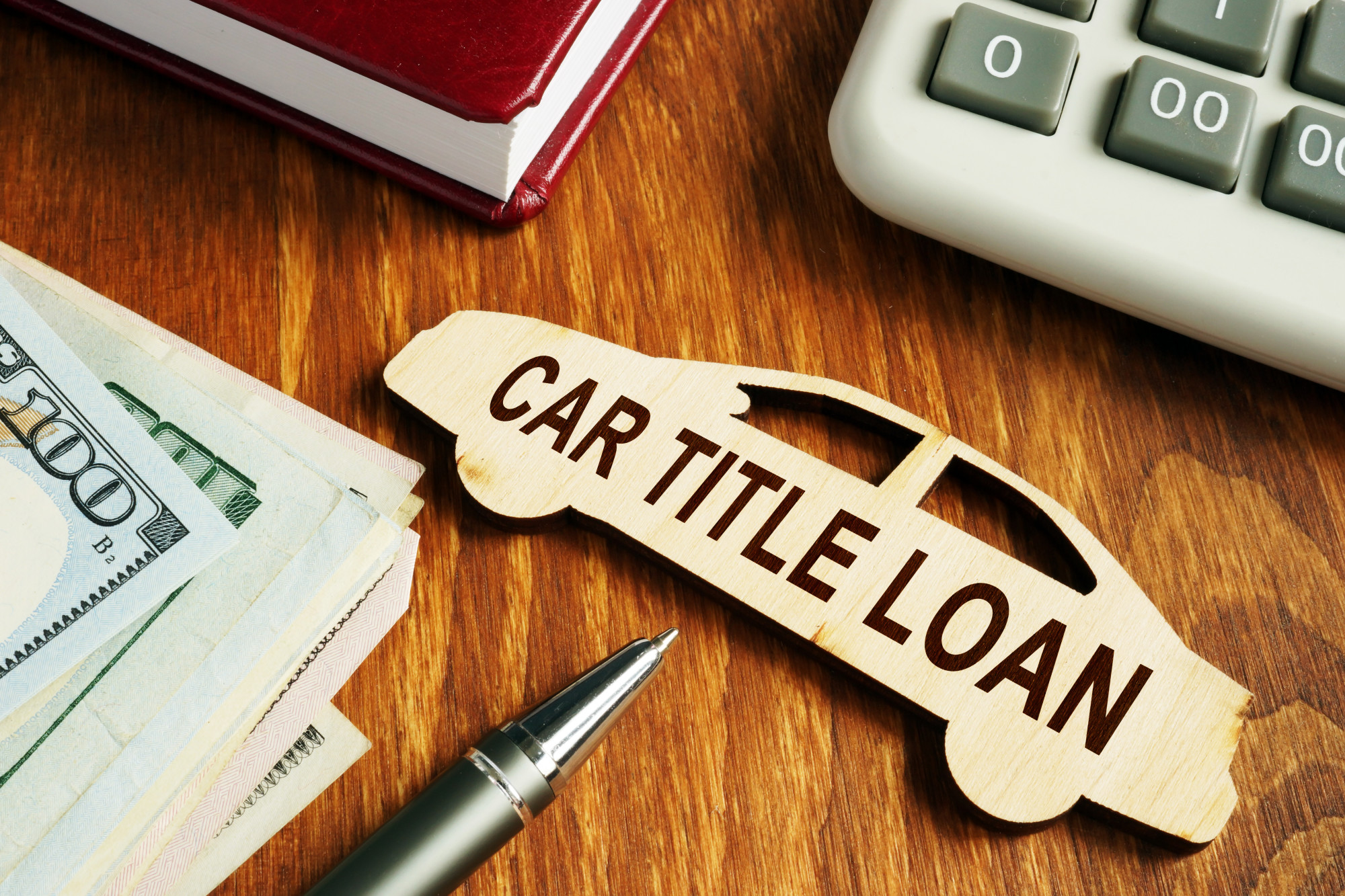 car title loan text on car on desk