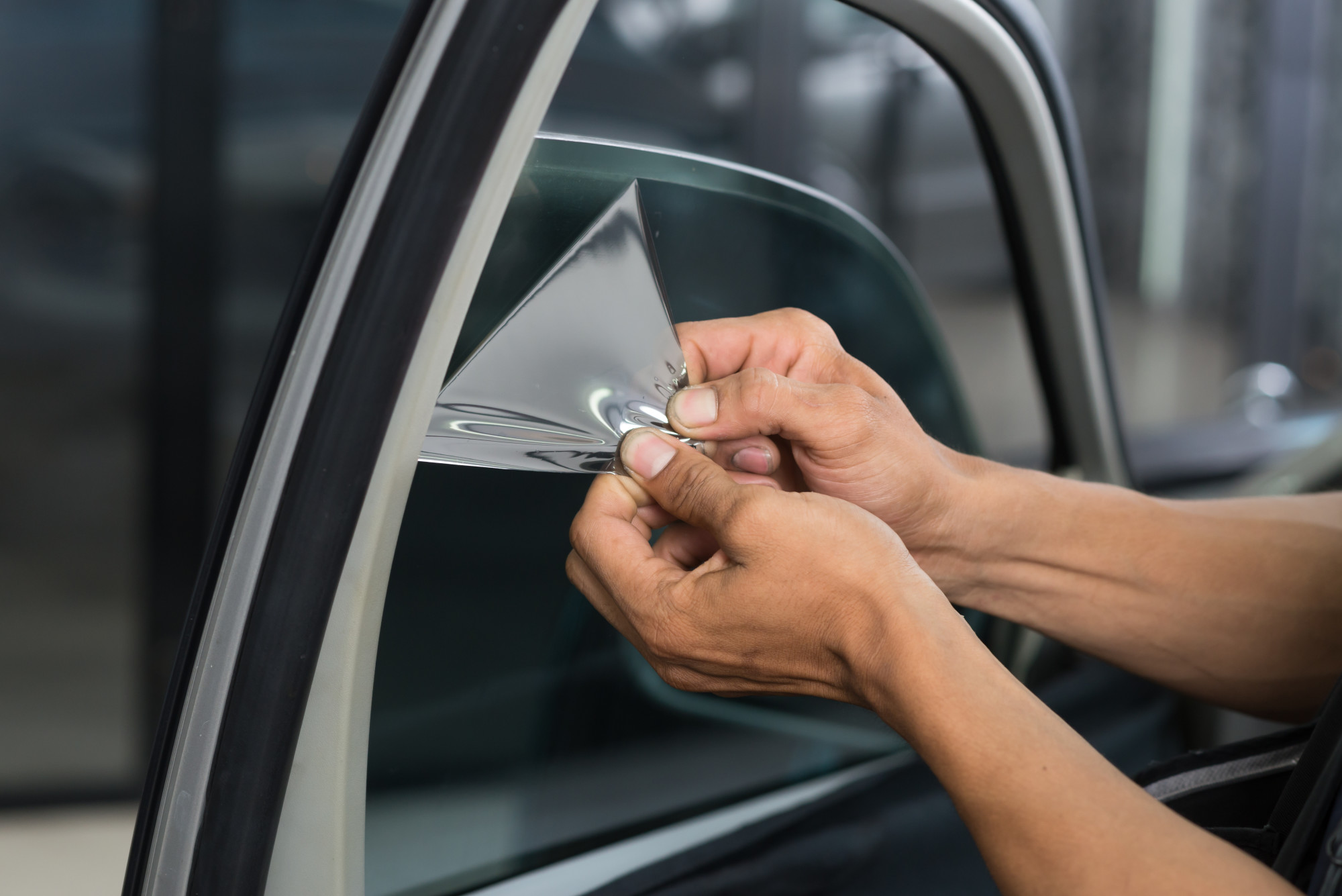 window tint being applied to car window