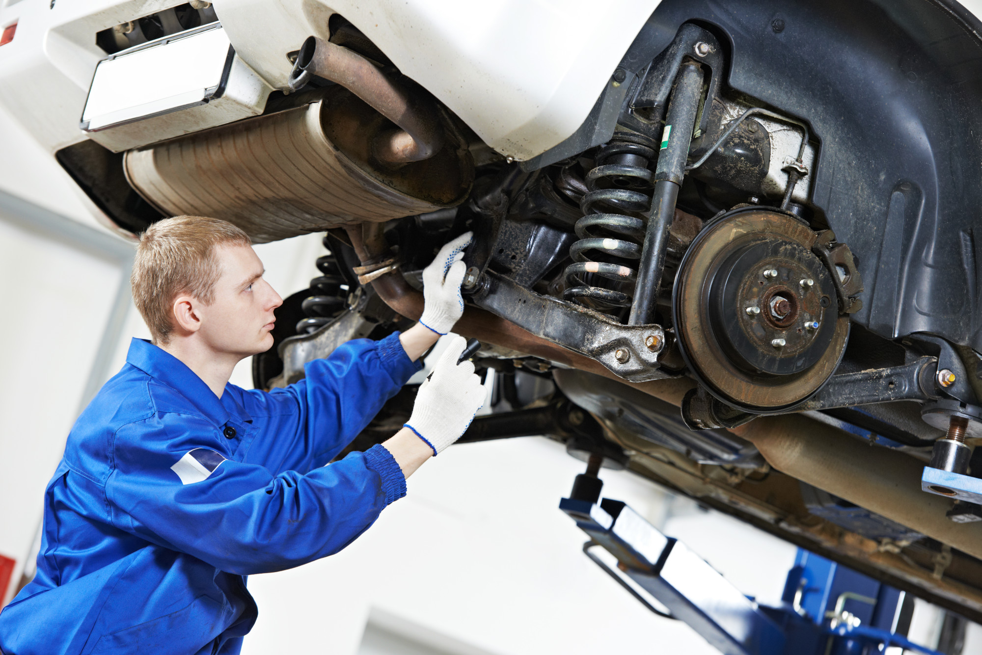 Man Repairing Car Suspension