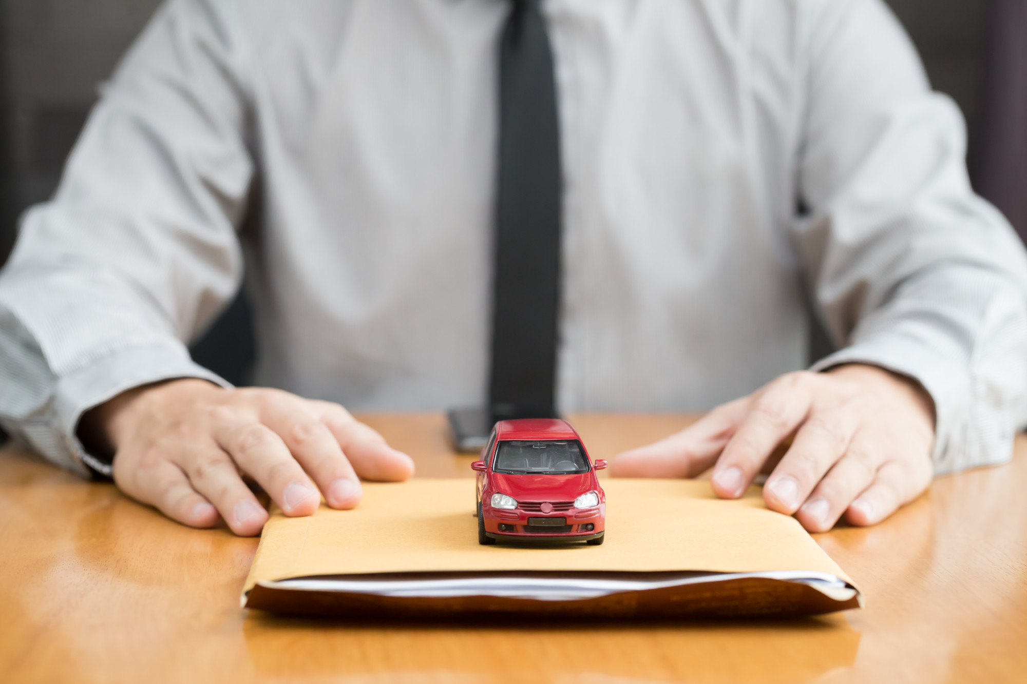 Man Holding Car Title