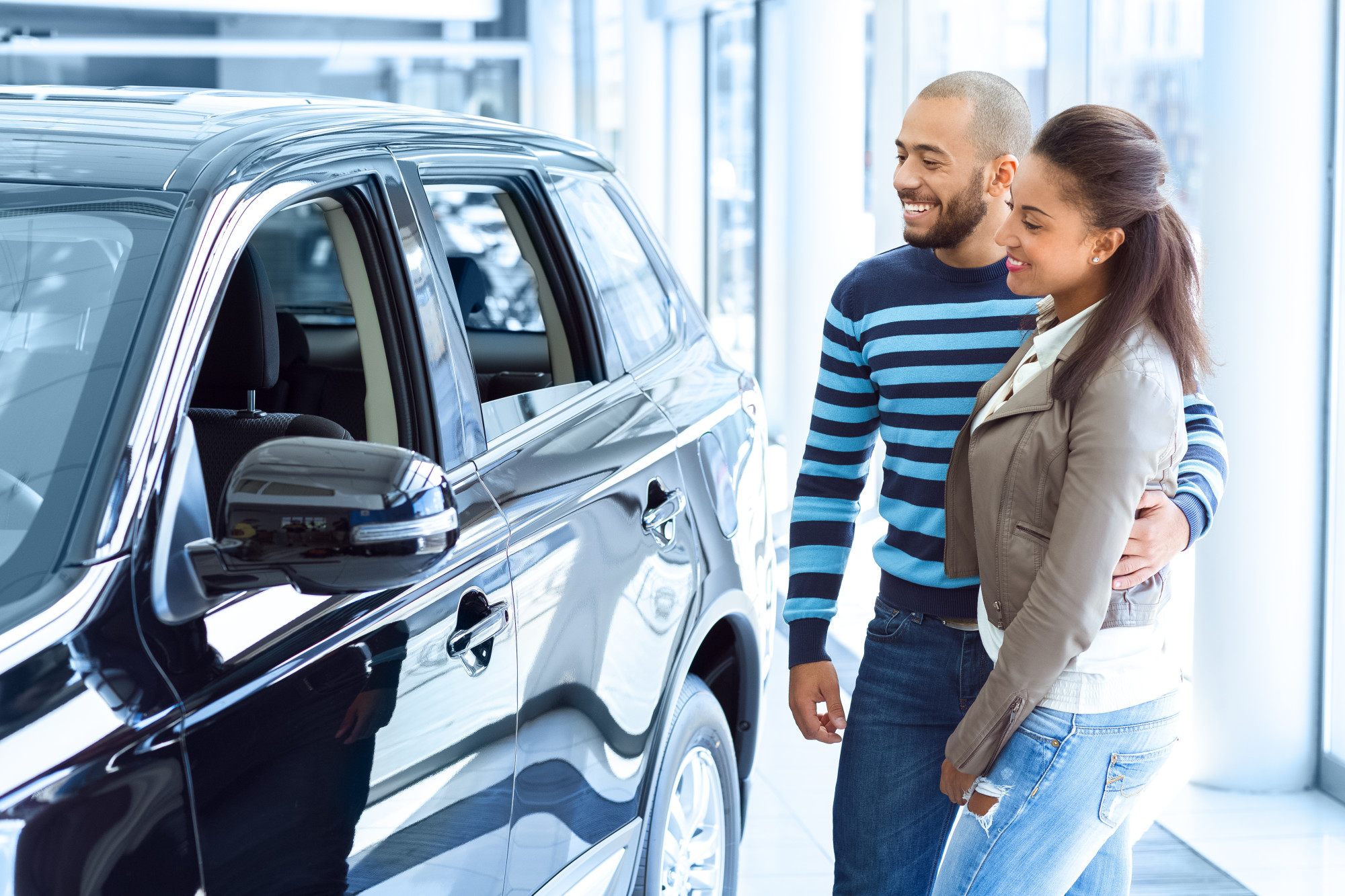 Couple Checking Out a Used Car